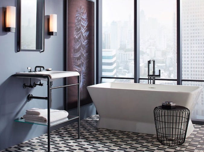 Bathroom with free standing bathtub in front of a window