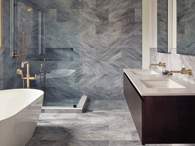 Bathroom with free standing bathtub widh brushed brass faucets