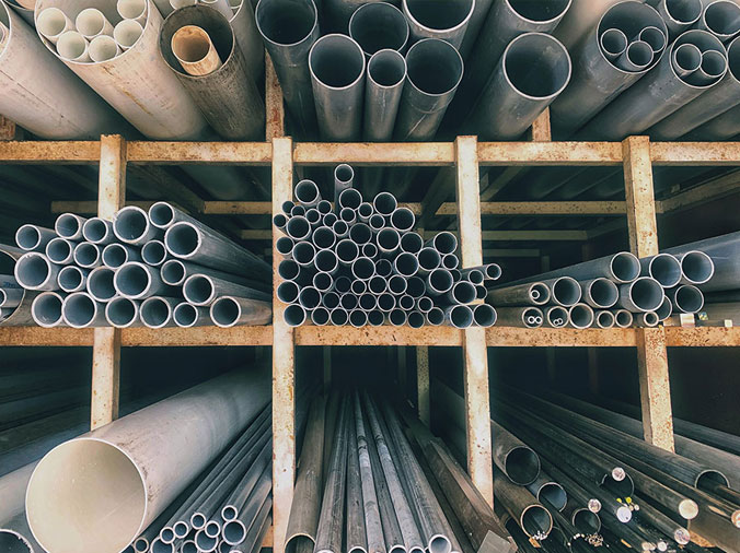 Steel pipes and PVC pipes in a plumbing supple warehouse