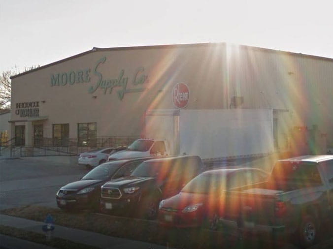 Sunbeams shinign over the Moore Supply Denton building exterior